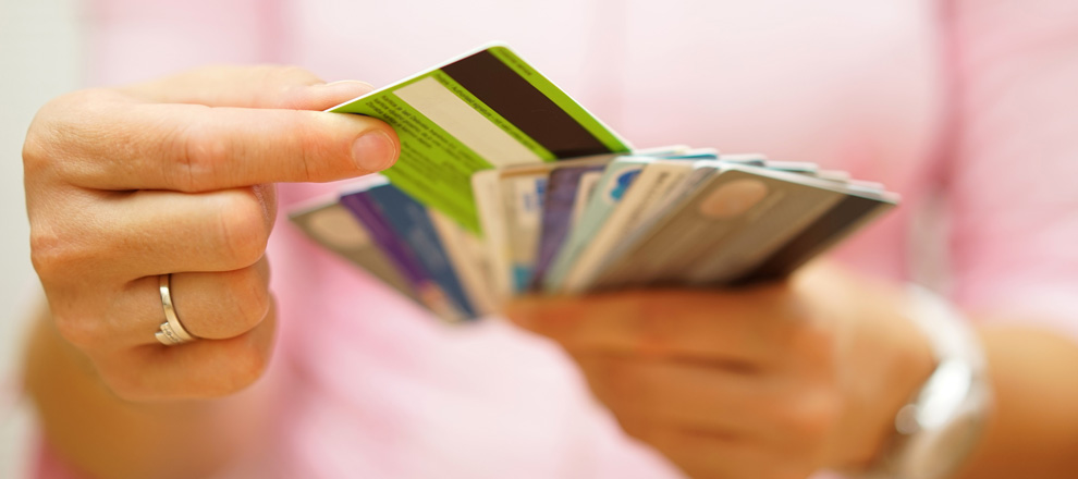 Woman holding several credit cards